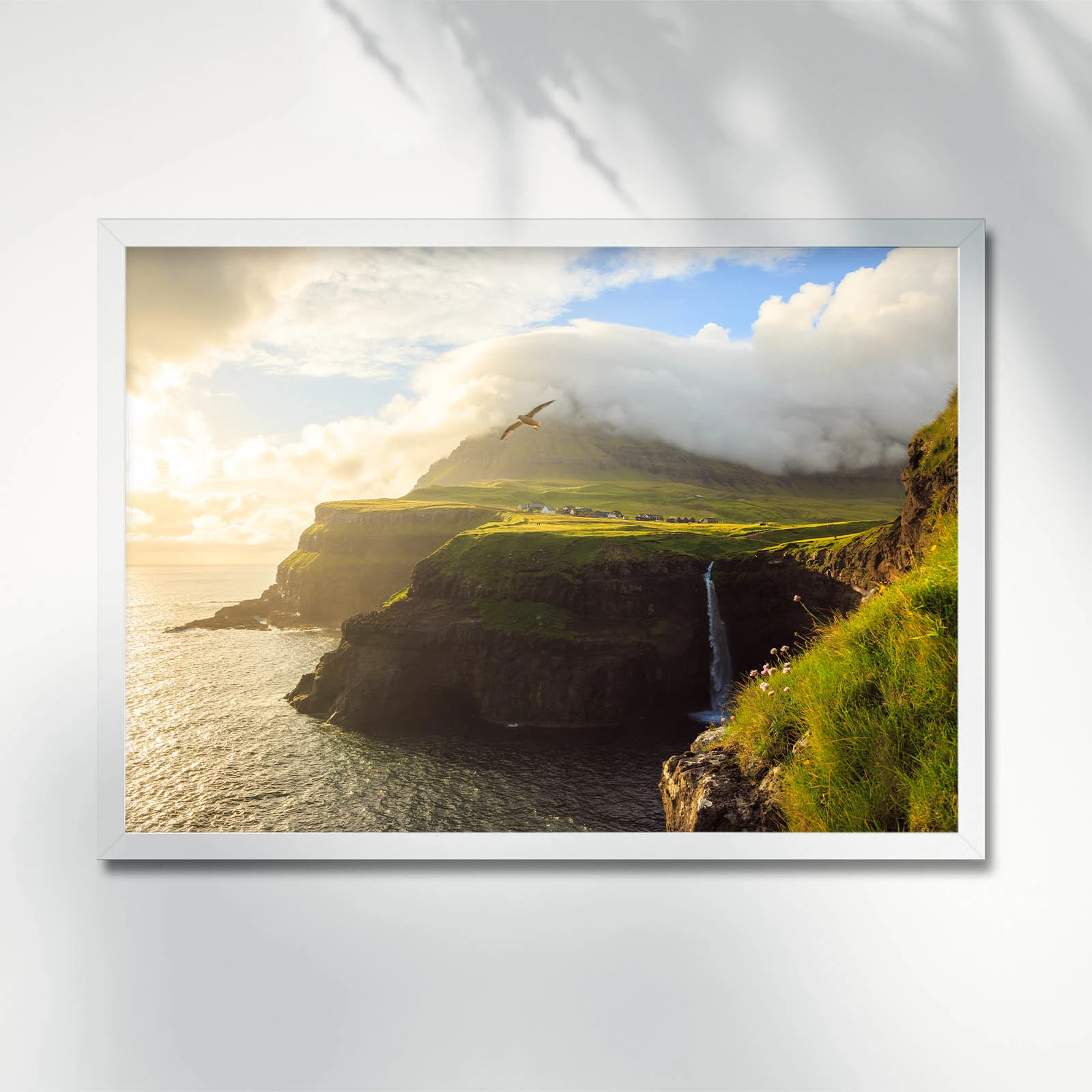 Waterfall cascading into ocean in Gasadalur. Faroe Islands